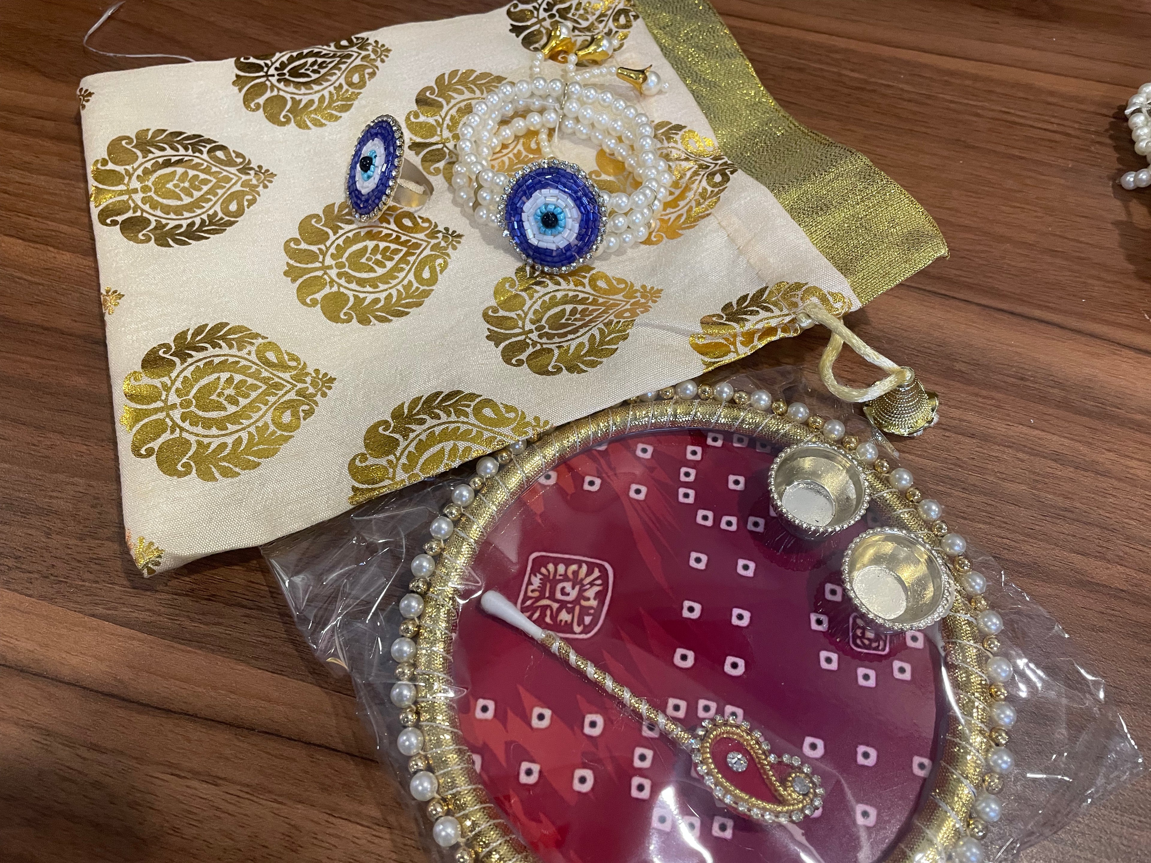 Tilak Thali Gift Hamper - Tilak Thali 6 Inches, Bracelet and Ring in a Potli