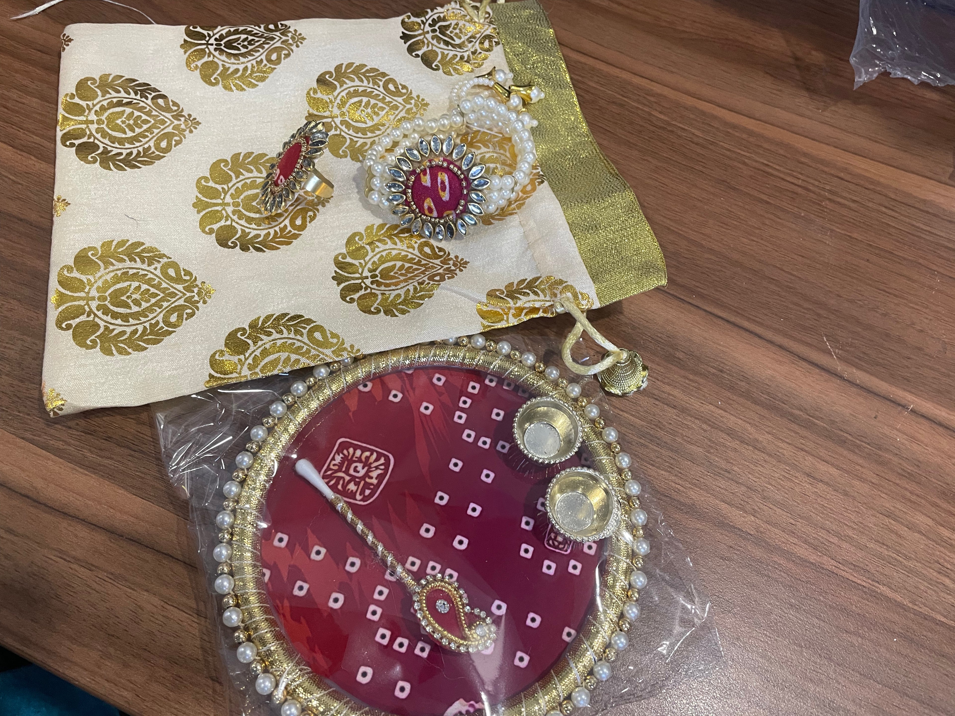 Tilak Thali Gift Hamper - Tilak Thali 6 Inches, Bracelet and Ring in a Potli