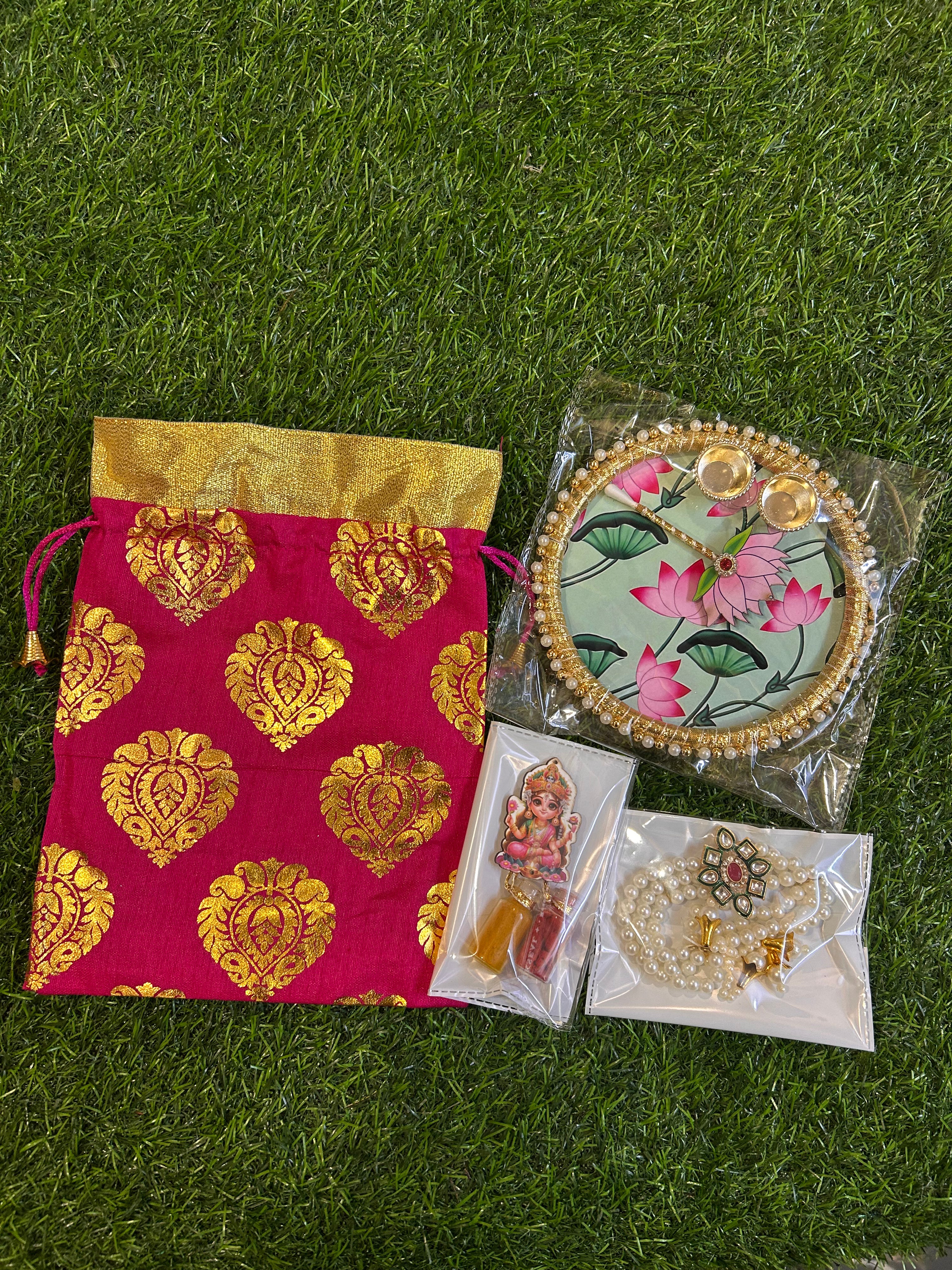 Haldi-Kumkum Gift Hamper - Potli, Tilak Thali, Bracelet and Haldi-Kumkum Bottles