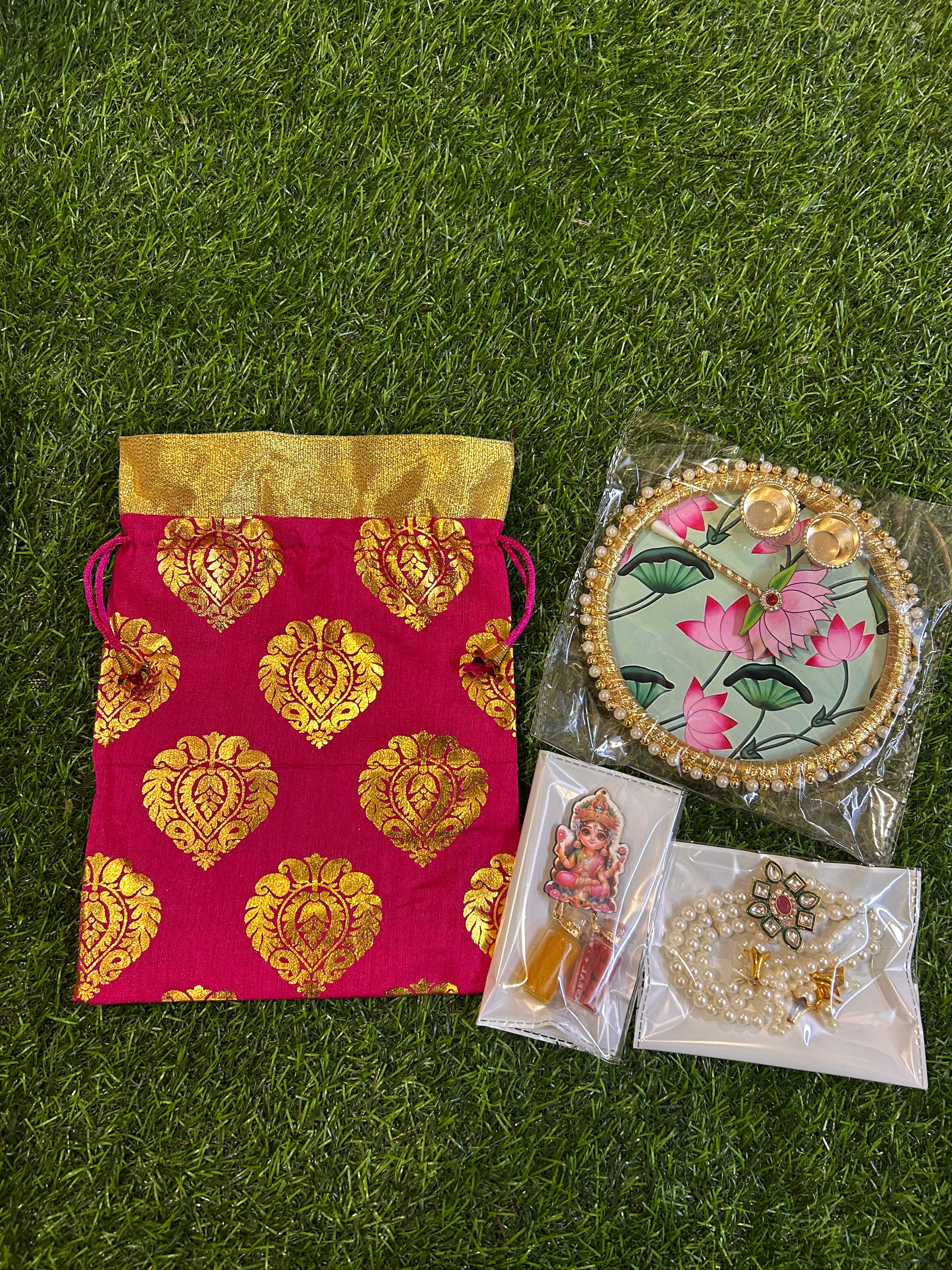 Haldi-Kumkum Gift Hamper - Potli, Tilak Thali, Bracelet and Haldi-Kumkum Bottles