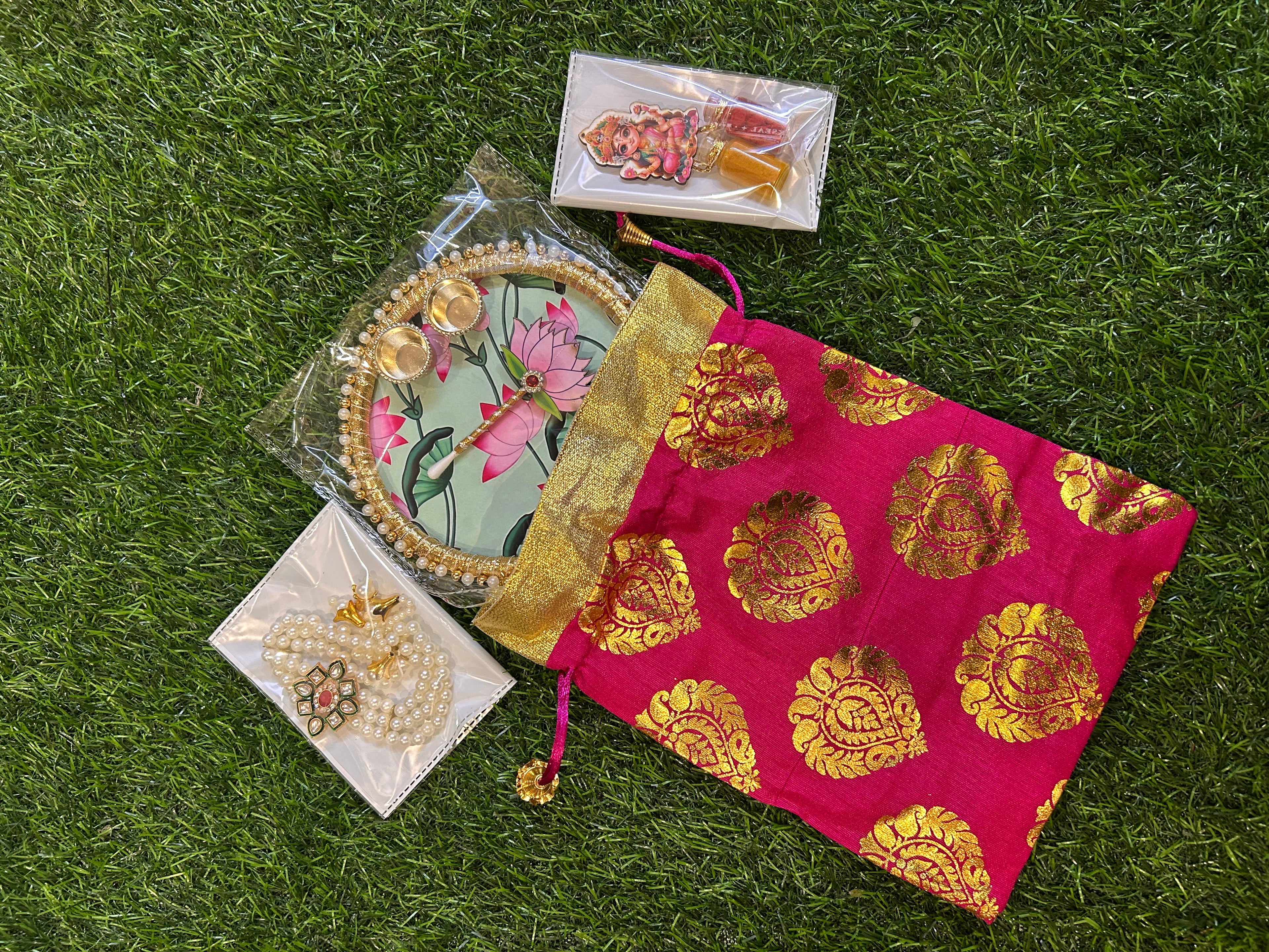 Haldi-Kumkum Gift Hamper - Potli, Tilak Thali, Bracelet and Haldi-Kumkum Bottles