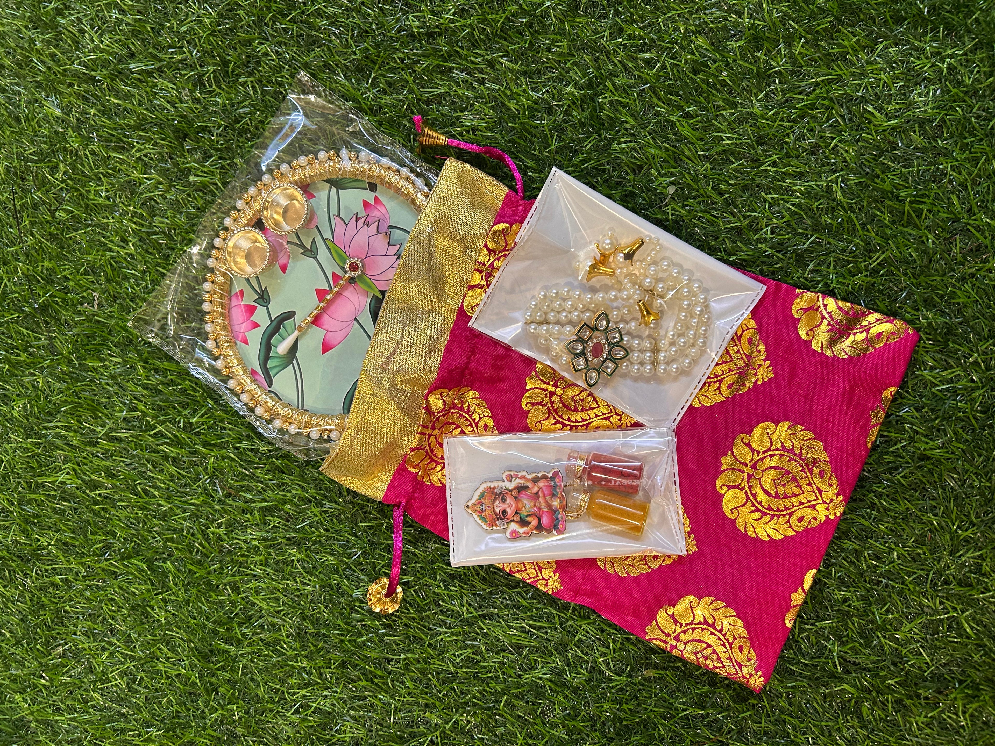 Haldi-Kumkum Gift Hamper - Potli, Tilak Thali, Bracelet and Haldi-Kumkum Bottles