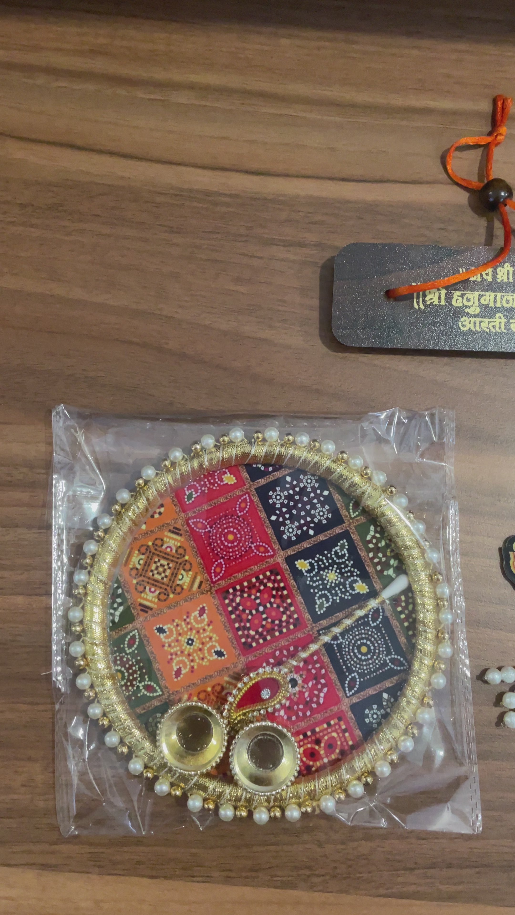 Return Gift Hamper - Tilak Thali 6 Inches, Hanuman Chalisa Wooden Work, Srinath Ji Brooch in a Potli